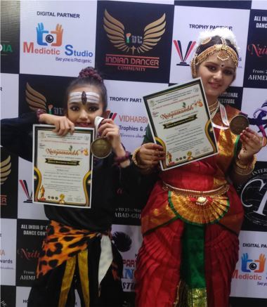 Khushi Oza of class 10B bagged second position and Mudrika Oza of 6A bagged third position in solo performance in Bharatnatyam